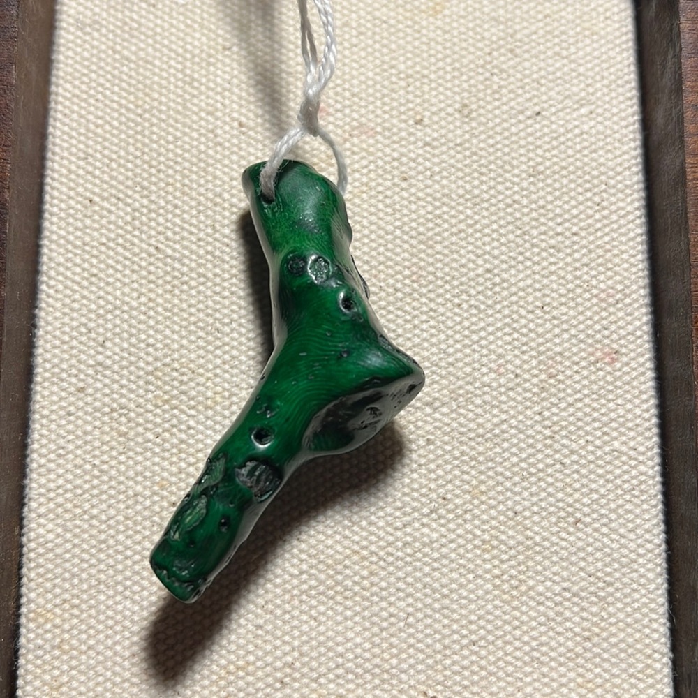 Featuring a Malachite stone